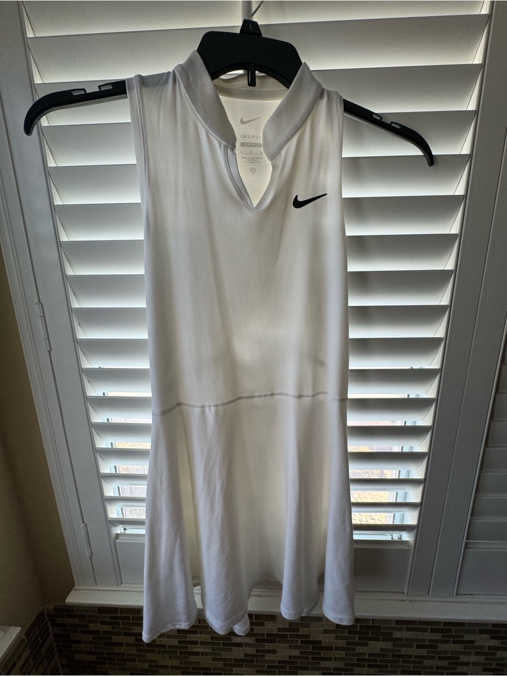 Nike White Sleeveless Mini Tennis Dress with Black Swoosh